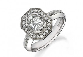Phoenix Cut™ Rubover set ring surrounded with pave brilliant cut diamonds